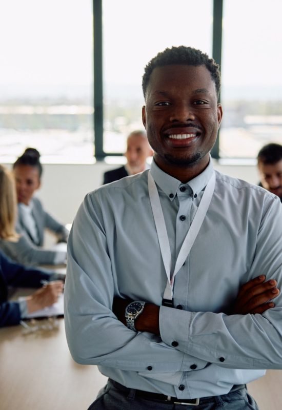 happy-black-ceo-with-arms-crossed-in-meeting-room-2026-01-06-10-29-13-utc (1) (1)